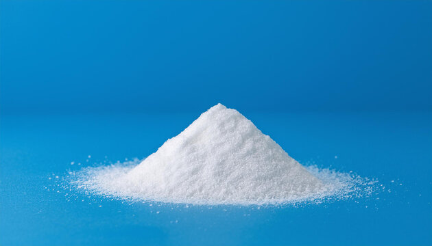 Heap of white titanium dioxide powder. Calcium carbonate, magnesium or zinc oxide. Close-up.