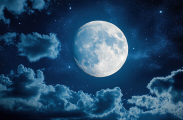 Obraz premium A luminous full moon shines brightly in the night sky, casting its glow over soft clouds and creating a serene atmosphere