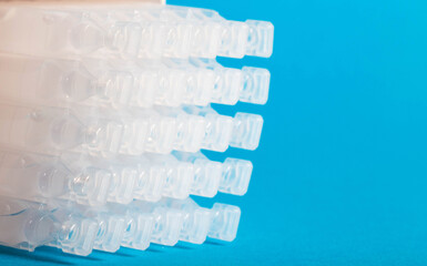 Tubes with a new generation probiotic on a blue background for the treatment of intestinal...