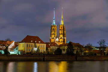Naklejka premium Wrocław Cathedral at Night – Illuminated Gothic Landmark..