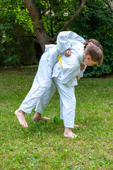 children learning life skills through martial arts, Partnered practice in judo, lesson in cooperation and mutual respect, goal-setting