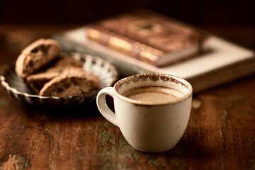 Cup of coffee on wooden background. Soft focus. Copy space