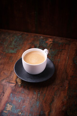 Cup of coffee on wooden background. Soft focus. Copy space