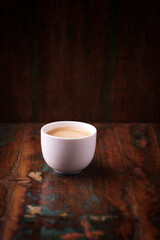 Cup of coffee on wooden background. Soft focus. Copy space