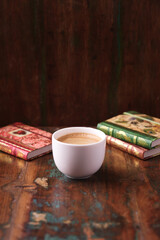 Cup of coffee on wooden background. Soft focus. Copy space