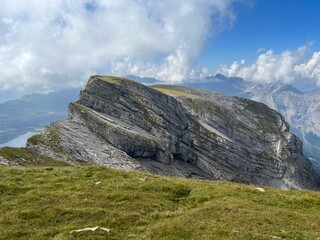 Alpine peaks Chli Hohmad (2492 m) and Gross Hohmad (2307 m) above the Tannensee lake (or Tannen lake) and in the Uri Alps mountain massif, Melchtal - Canton of Obwalden, Switzerland (Kanton Obwald)