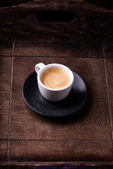 Cup of coffee on wooden background. Soft focus. Copy space