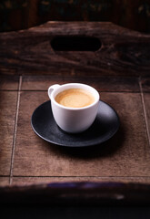 Cup of coffee on wooden background. Soft focus. Copy space