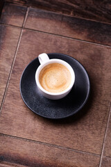 Cup of coffee on wooden background. Soft focus. Copy space