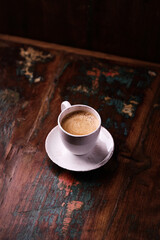 Cup of coffee on wooden background. Soft focus. Copy space