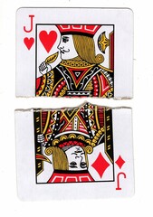A vintage playing card made up of torn halves.
