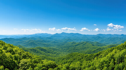 A stunning panoramic view of lush green mountains under a bright blue sky, showcasing nature's beauty and tranquility.
