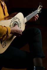 Musician playing the baroque guitar