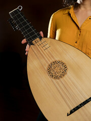 Woman holding a lute instrument