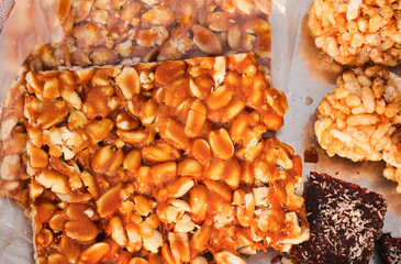Peanut chikki and mandvi chikki are sweet dishes made with jaggery, peanut and Murmura laddu, puffed rice laddu, groundnut Chikki (fudge), Indian festival makar Sankranti special sweet. Khajur Pak.