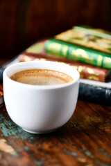 Cup of coffee on wooden background. Soft focus. Copy space.	