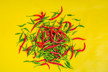 Red and green chilies scattered