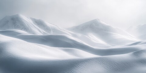 Obraz premium A cold, serene mountainous landscape in winter. Snow-covered hills roll into the distance.
