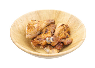 Grilled chicken pieces in a wooden bowl isolated transparent background