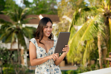 Fototapeta premium young woman using tablet computer