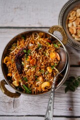 Tamarind rice or Puliyogare | Puliyodharai served with yogurt, selective focus