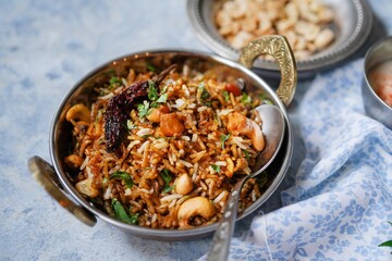 Tamarind rice or Puliyogare | Puliyodharai served with yogurt, selective focus