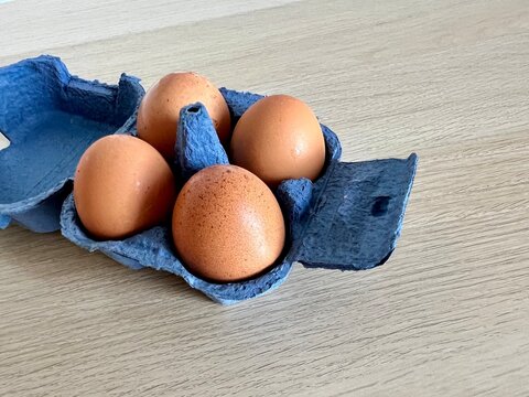 Brown eggs in an egg carton. Perfect for healthy food themes, protein-rich diets, Easter designs, or concepts emphasizing freshness, simplicity, and natural ingredients.