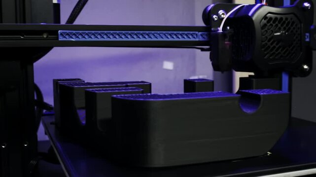 Shot of a 3D printer with purple light