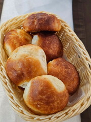 Buns in a wicker basket on the table