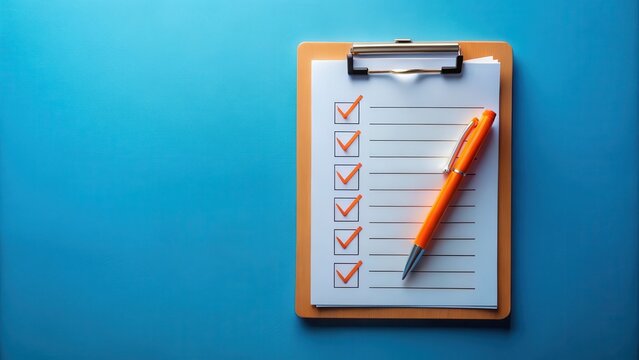 Organizational checklist document on clipboard with vibrant orange pen markings on blue surface background , checklist, office supplies