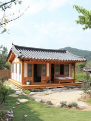 Korean house nestled in a beautiful grassy landscape with trees