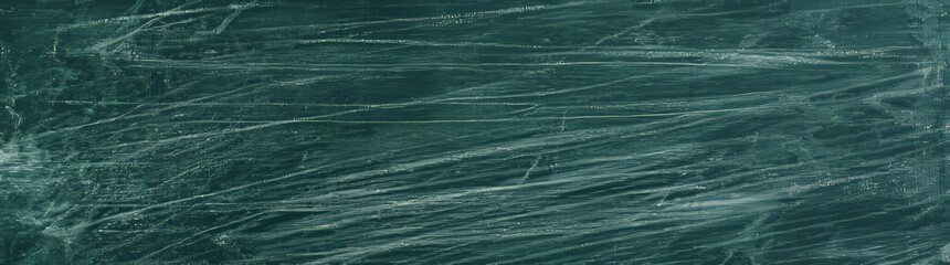 Green chalkboard serves as the backdrop for chalk marks being erased on a wide banner