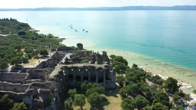Grotto of Catullus Sirmione Lake of Garda Aerial Drone View. Archaeological site of Grotte di Catullo, Sirmione, Italy early morning aerial view. lake garda.