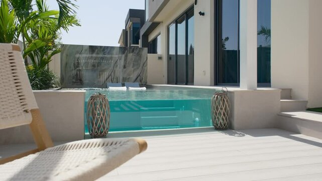 A small private swimming pool in the backyard of a luxury villa in Dubai on a sunny day