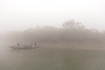 SUNDARBAN, INDIA-JANUARY 05: Fishermen fishing at Sundarban Tiger Reserve, West Bengal, India on January 05, 2025