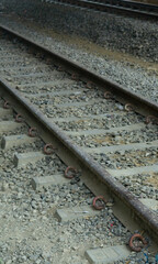 Weathered Railway Tracks with Rusty Metal Rails