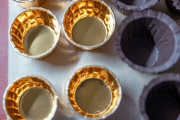 Brown and gold cupcake boxes, food and supplies for queues and parties
