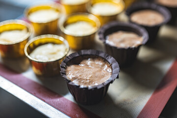 Baking process of chocolate vanilla cupcake dessert, meditation, healthy organic low sugar diet, small bakery, home baking, self care and happiness, batter in stainless steel spoon