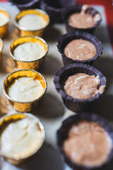 Baking process of chocolate vanilla cupcake dessert, meditation, healthy organic low sugar diet, small bakery, home baking, self care and happiness, batter in stainless steel spoon