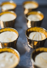 Baking process of chocolate vanilla cupcake dessert, meditation, healthy organic low sugar diet, small bakery, home baking, self care and happiness, batter in stainless steel spoon