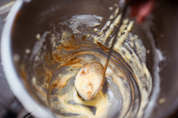 Home Low Sugar Party Baking Mixture in a mixing bowl,rustic and messy home kitchen