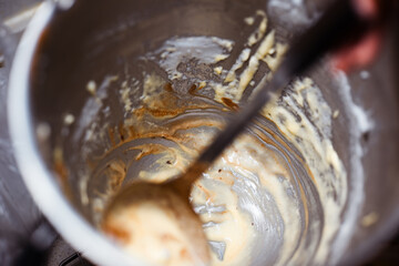 Home Low Sugar Party Baking Mixture in a mixing bowl,rustic and messy home kitchen
