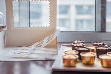 Chocolate and vanilla cupcakes, organic low sugar cupcakes for parties and gatherings, small baking business, green cupcake packaging boxes