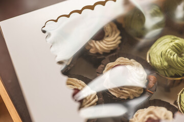 Chocolate cherry and matcha flavor cupcakes, exquisitely packaged in cartons, recyclable packaging supplies, green and environmentally friendly, organic low-sugar diet