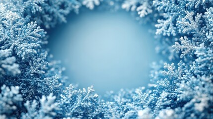 Frosty snowflake border creating a serene winter scene with a soft blue background