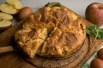 Delicious cinnamon cake with fresh apple pieces. Traditional German recipe.