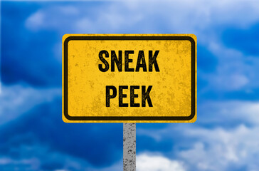 Sneak peek message written on yellow metal sign. Conceptual sneak peek symbol. Copy space.