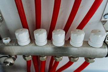 This detailed and upclose view showcases a heating system that prominently features vibrant red...