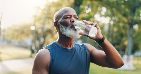 Exercise, senior man and drinking water at park for fitness break, hydration or recovery from running. Detox, black person and liquid bottle for refresh, cardio workout or marathon training in nature