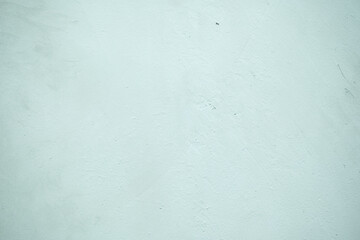 A lime green wall with a textured surface and distinct patterns, creating a vibrant and modern aesthetic